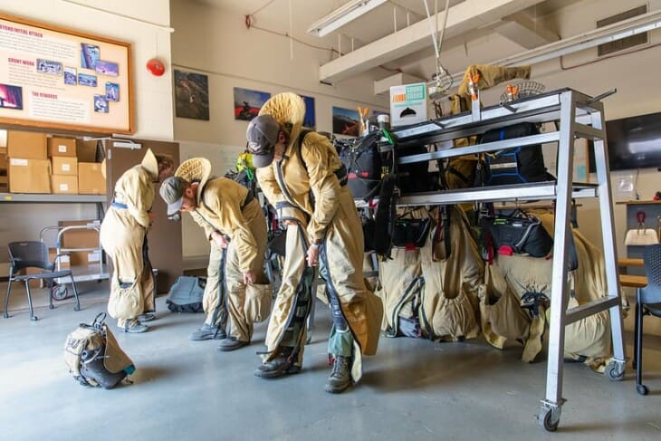 bureau of land mangement smokejumpers suiting up for a training jump in boise, idaho